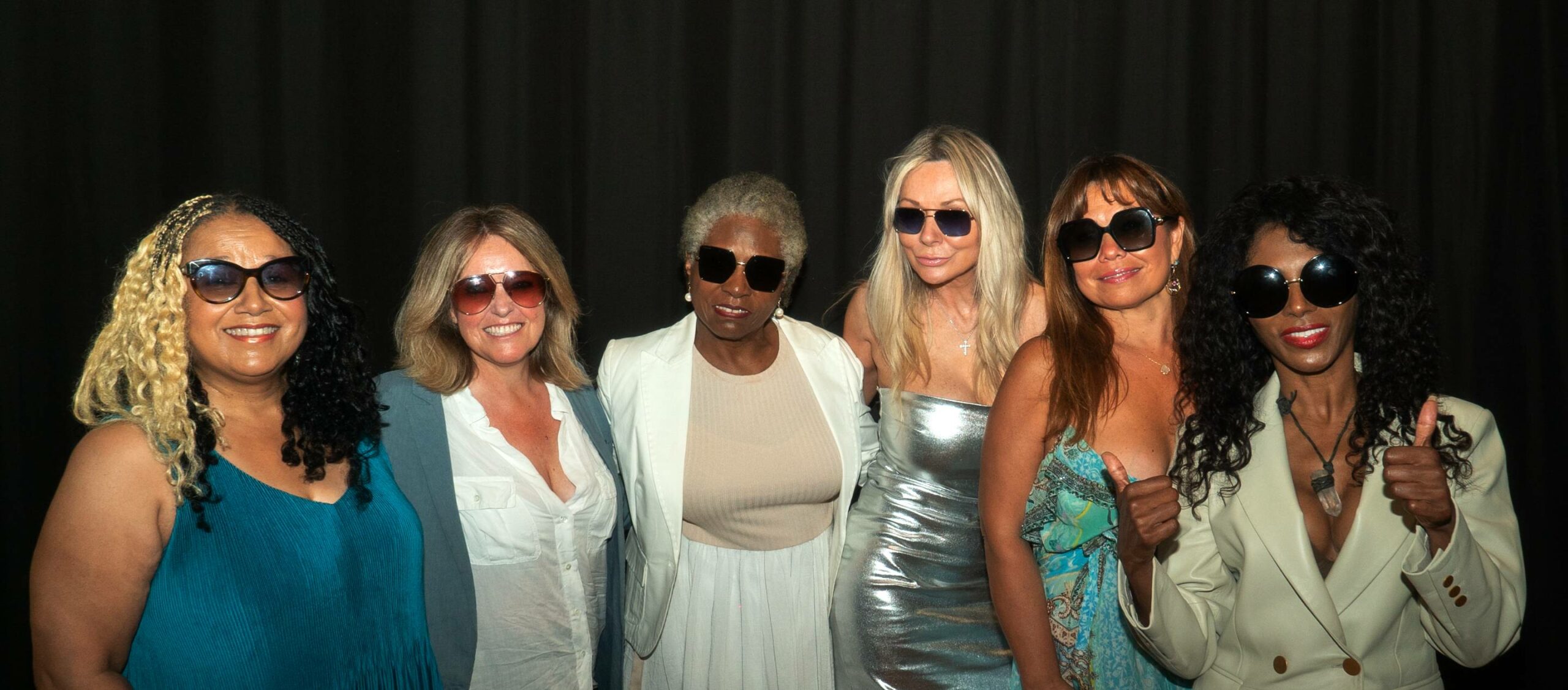 sinitta and 5 women posing in sunglasses