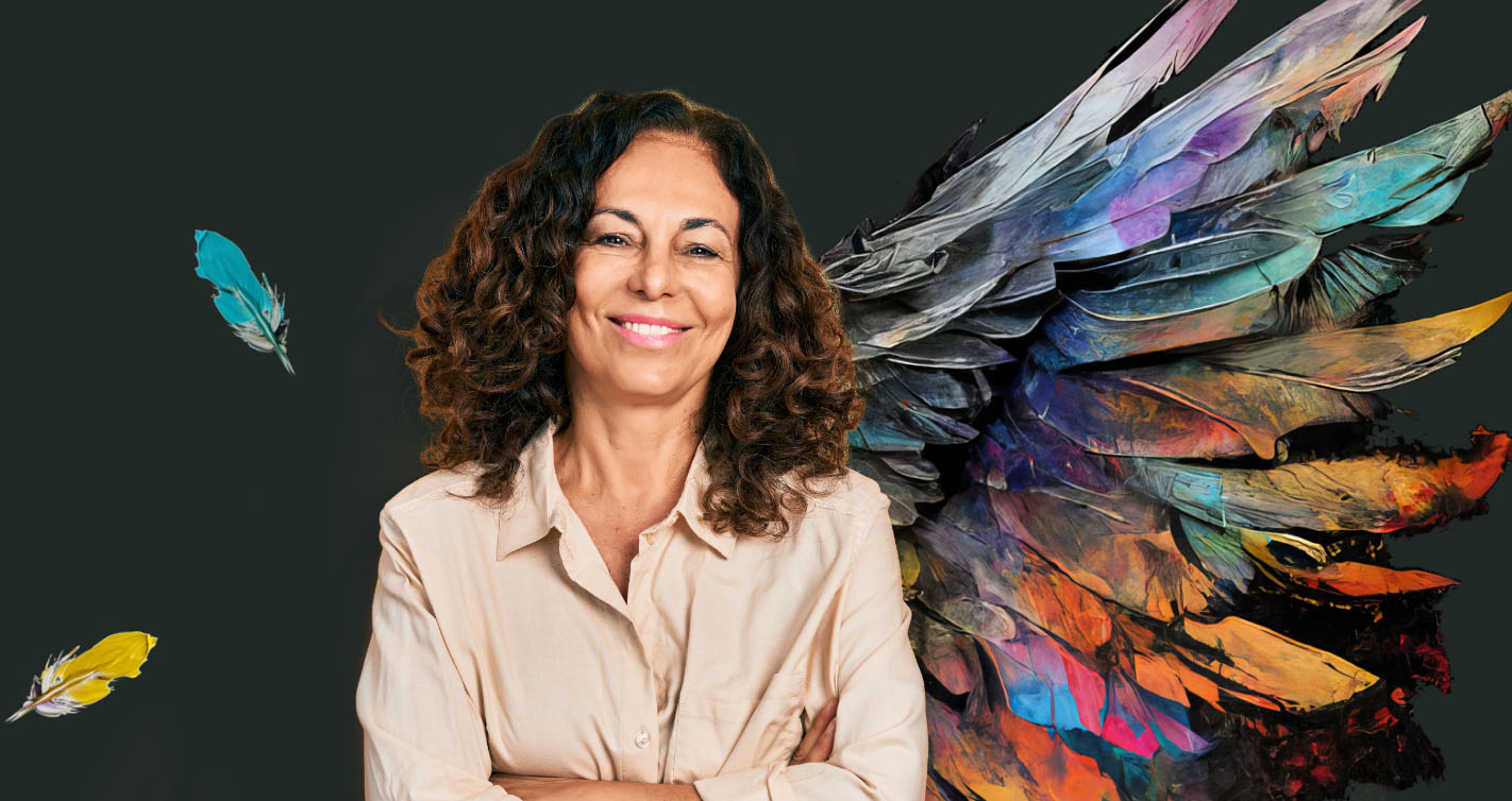 woman with curly brunette hair in front of angel wing