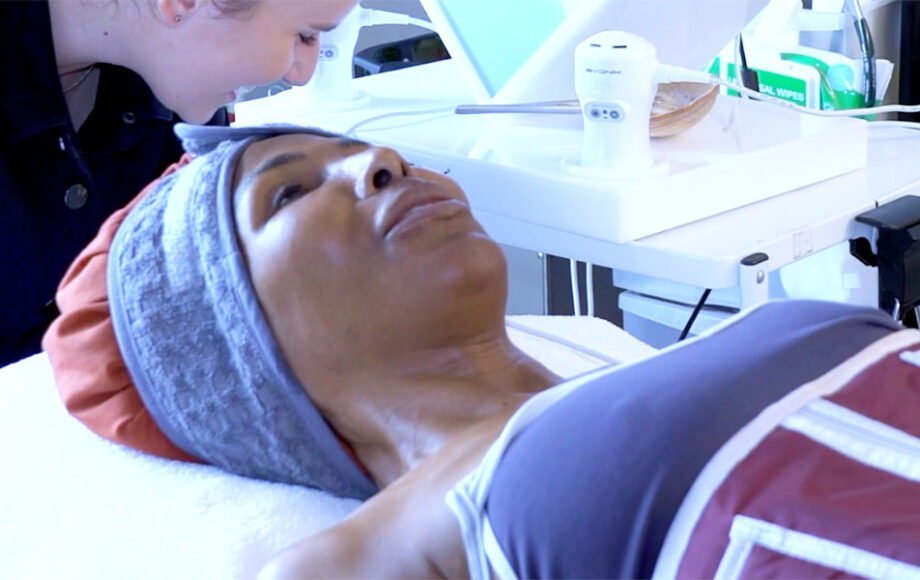 woman lying on bed getting treatment