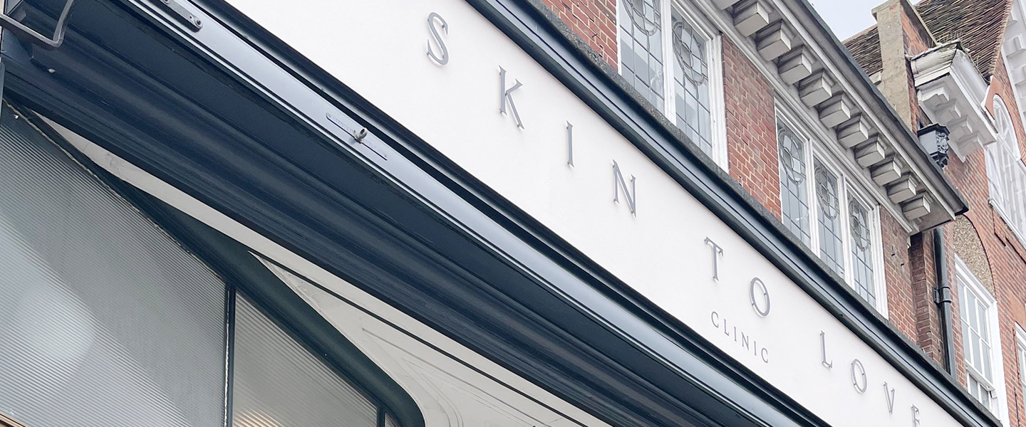 shopfront sign for skin to love clinic