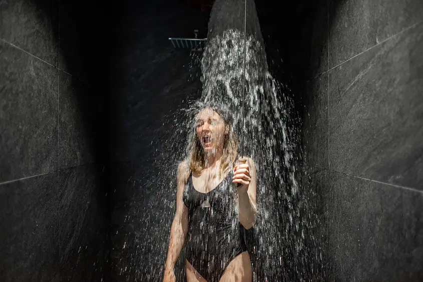 Woman under a cold shower