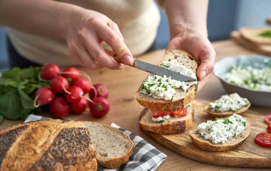 Woman-making-preparing-sandwich-of-cottage-cheese