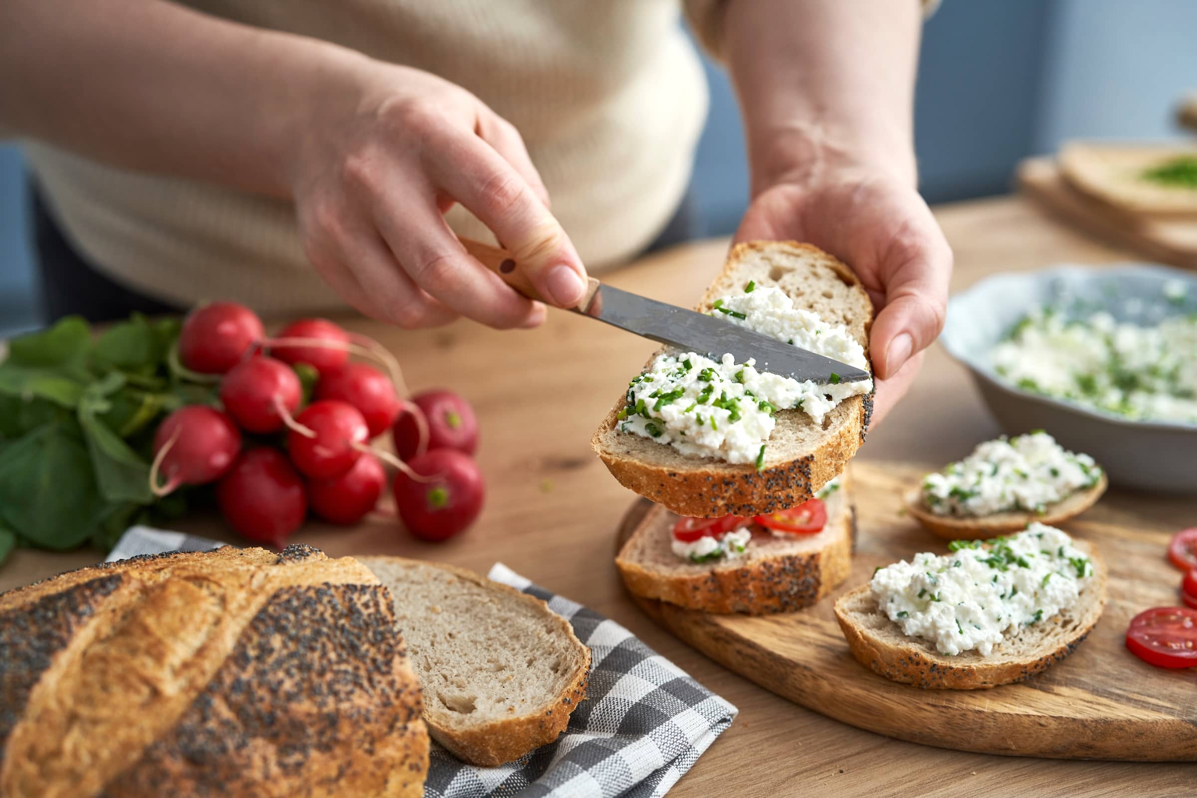 Woman-making-preparing-sandwich-of-cottage-cheese