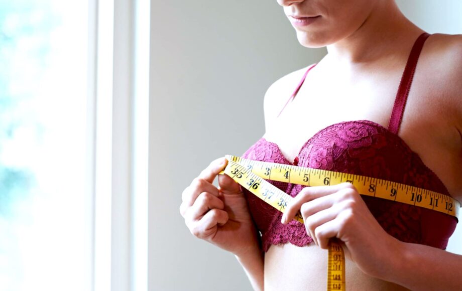 Woman measures across her bra